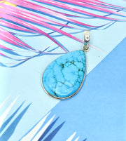 Turquoise Ring with Silver Side Detail