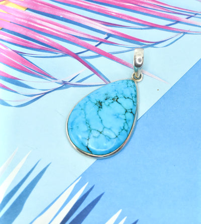 Turquoise Ring with Silver Side Detail