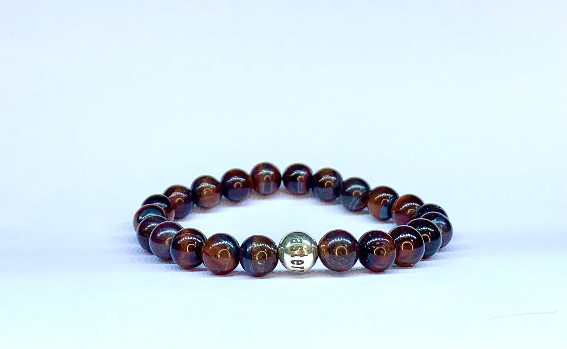 Red Tiger's Eye bead bracelet, with Eastern Adornment branded silver bead.