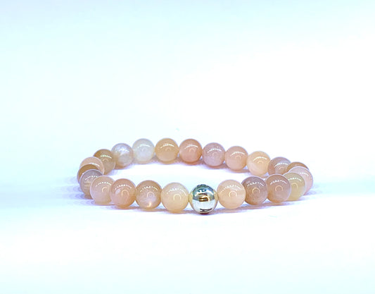 Peach Moonstone bead bracelet, with Eastern Adornment branded silver bead.