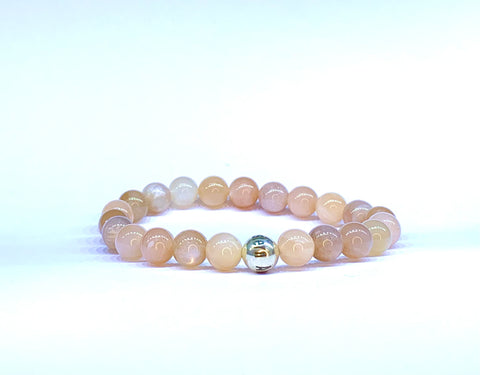Peach Moonstone bead bracelet, with Eastern Adornment branded silver bead.