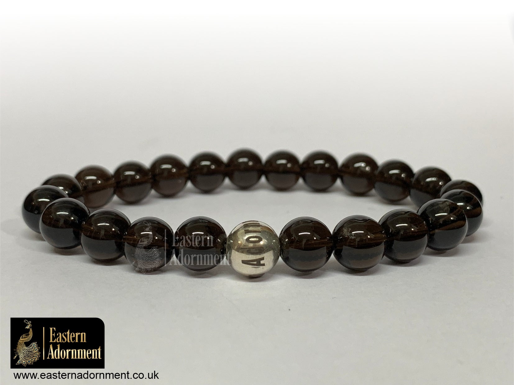 Deep brown Smoky Quartz bead bracelet, with Eastern Adornment branded silver bead.