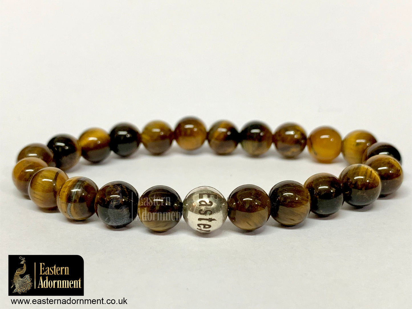 Golden Tiger's Eye bead bracelet, with Eastern Adornment branded silver bead.